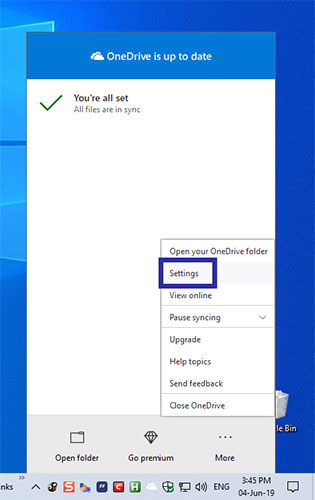 Right-click the OneDrive icon and select Settings